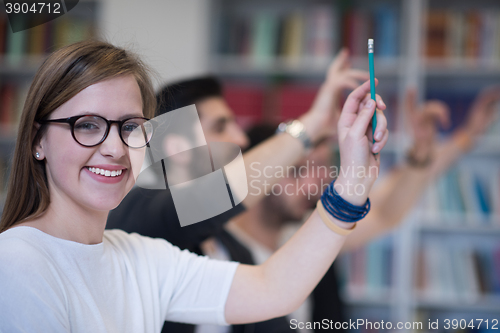 Image of group of students  raise hands up