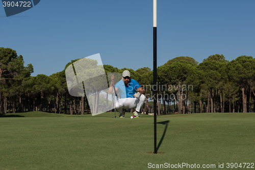 Image of golf player aiming perfect  shot
