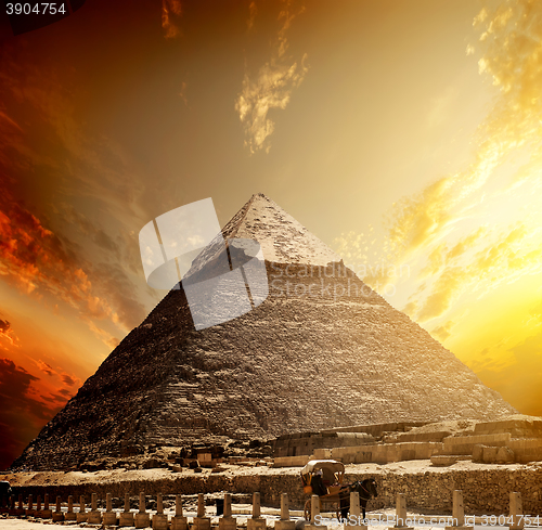 Image of Fiery sunset and pyramid