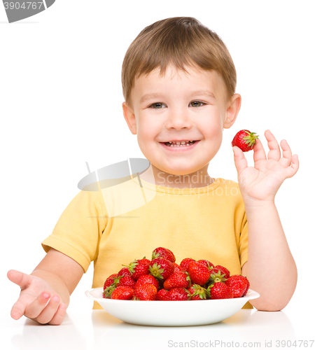 Image of Little boy with strawberries