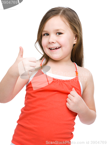 Image of Little girl is showing thumb up gesture