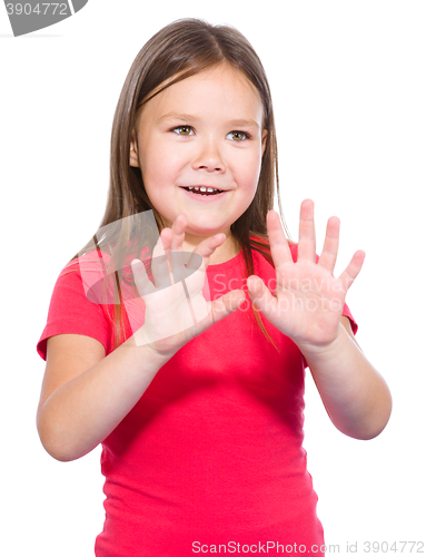 Image of Portrait of a little girl making stop gesture