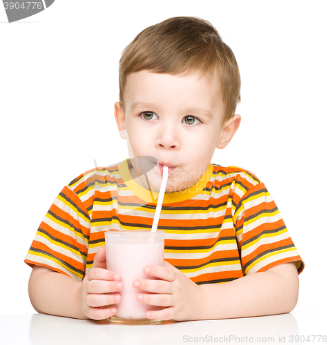 Image of Cute little boy with a glass of milk