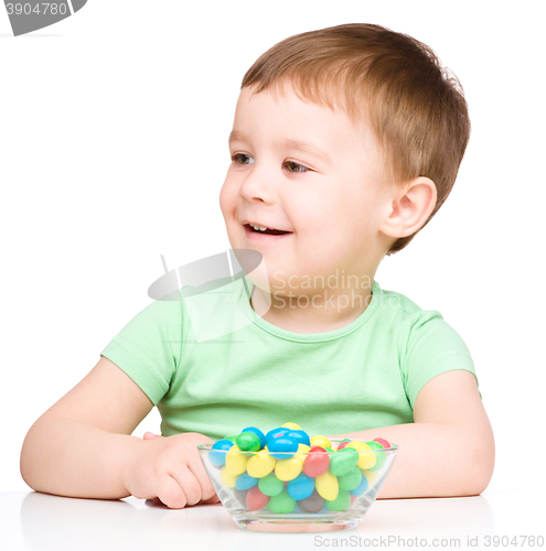 Image of Portrait of a boy with candies
