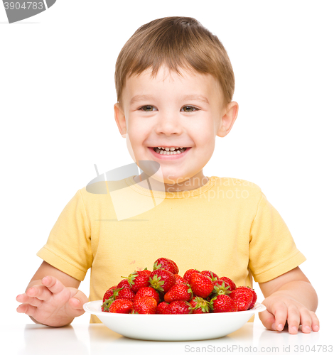 Image of Little boy with strawberries