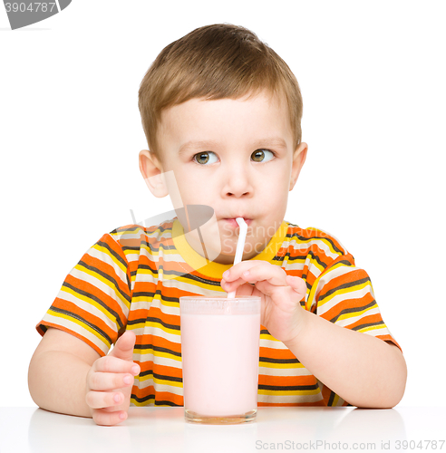 Image of Cute little boy with a glass of milk