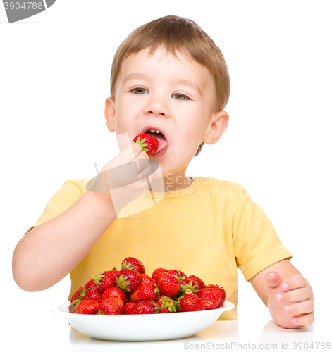 Image of Little boy with strawberries