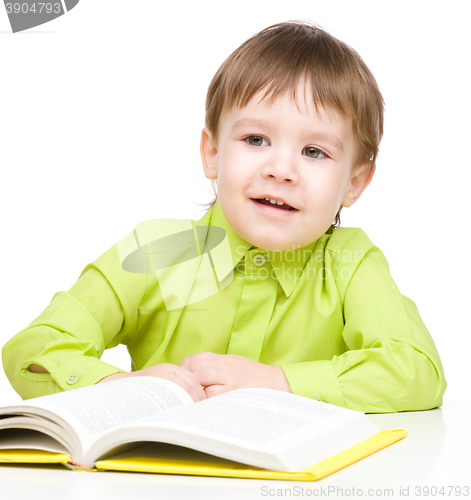 Image of Little child play with book