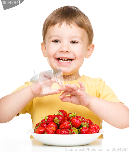 Image of Little boy with strawberries