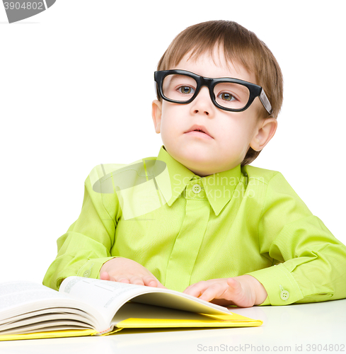 Image of Little child play with book