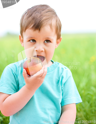 Image of Portrait of a little boy with apple