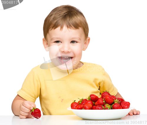 Image of Little boy with strawberries