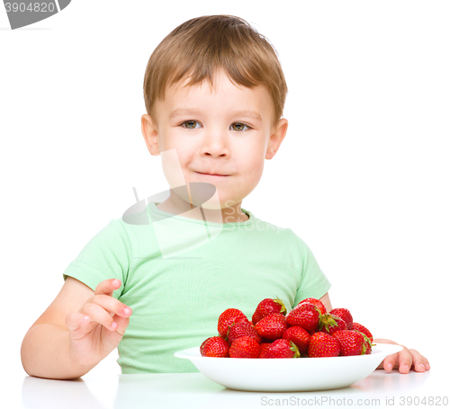 Image of Little boy with strawberries