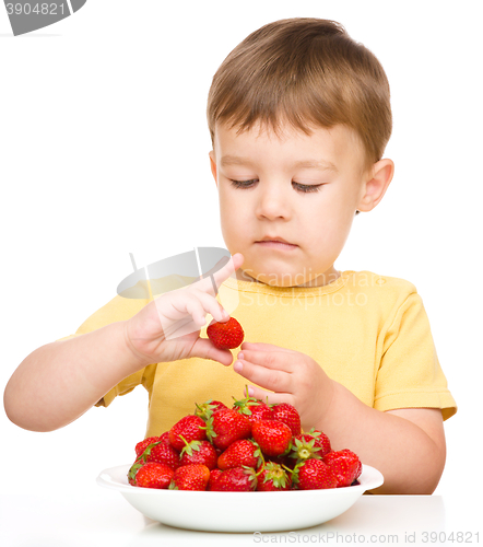 Image of Little boy with strawberries