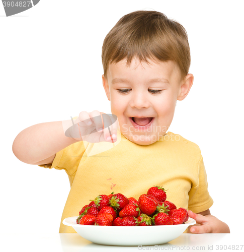 Image of Little boy with strawberries