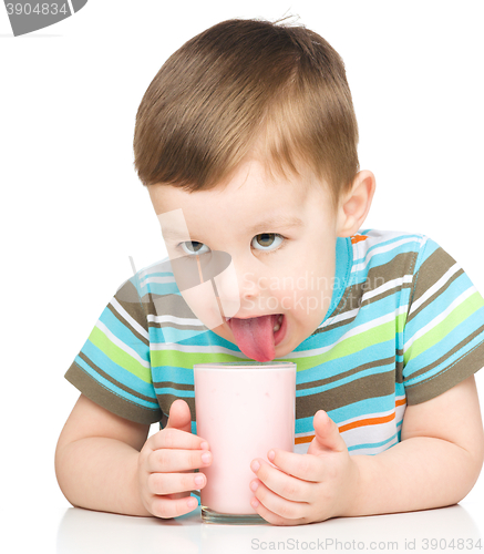 Image of Cute little boy with a glass of milk