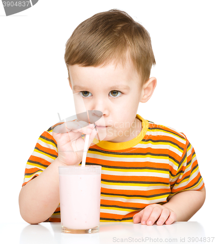 Image of Cute little boy with a glass of milk