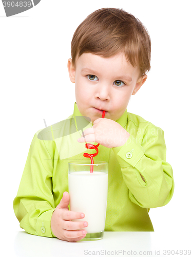 Image of Cute little boy with a glass of milk