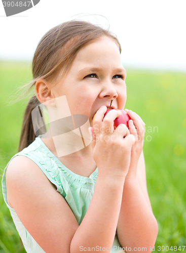 Image of Portrait of a little girl with apple