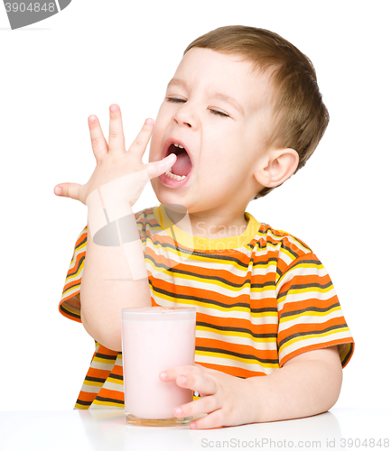 Image of Cute little boy with a glass of milk