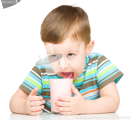 Image of Cute little boy with a glass of milk