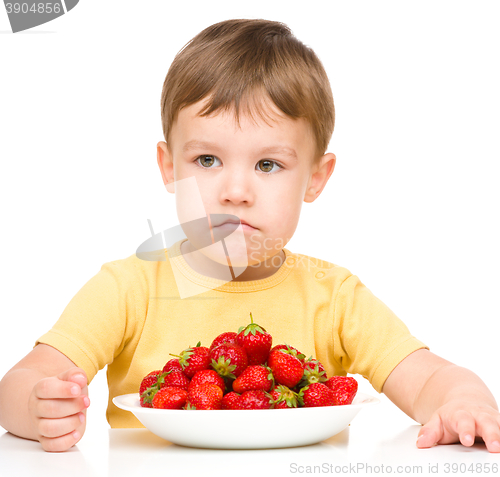 Image of Little boy refuses to eat strawberries