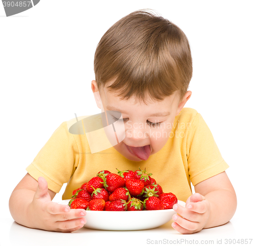 Image of Little boy with strawberries