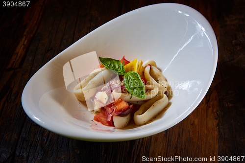 Image of healthy rings squid salad with tomatoes
