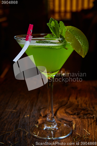 Image of Martini glass with green cocktail