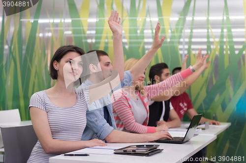 Image of students group raise hands up