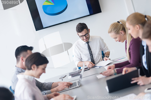 Image of young business people group on team meeting at modern office