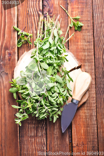 Image of marjoram on a wooden rustic table