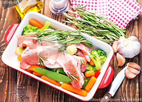 Image of raw meat with vegetables