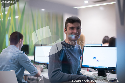 Image of technology students group working  in computer lab school  class