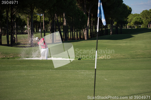 Image of golfer hitting a sand bunker shot