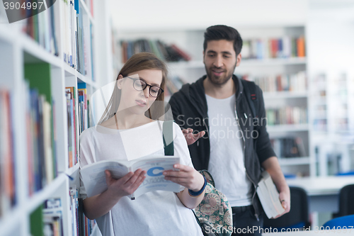 Image of students couple  in school  library