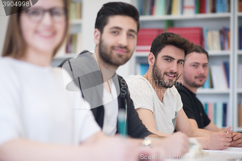 Image of group of students study together in classroom