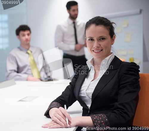 Image of young business woman on meeting  using laptop computer