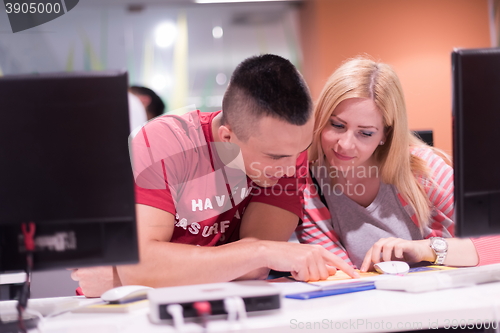 Image of technology students group working  in computer lab school  class