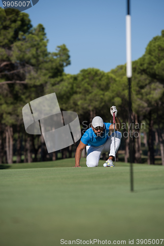 Image of golf player aiming perfect  shot