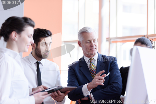 Image of young startup businessman making presentation to senior investio