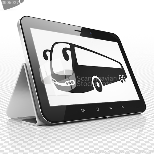 Image of Vacation concept: Tablet Computer with Bus on display