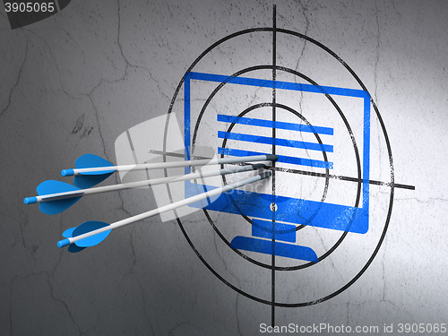 Image of Web development concept: arrows in Monitor target on wall background