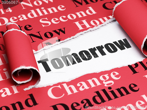 Image of Timeline concept: black text Tomorrow under the piece of  torn paper