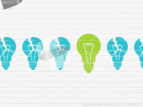 Image of Business concept: light bulb icon on wall background