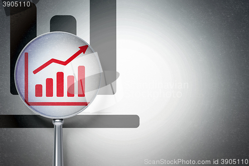 Image of Marketing concept:  Growth Graph with optical glass on digital background