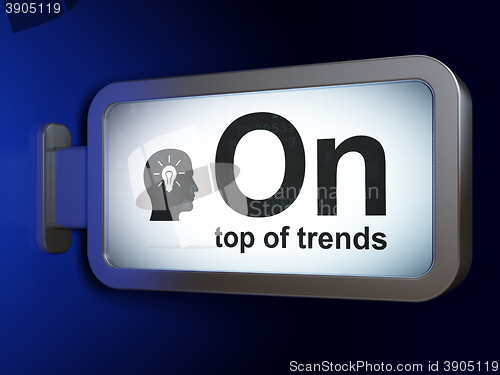 Image of Finance concept: On Top of trends and Head With Light Bulb on billboard background