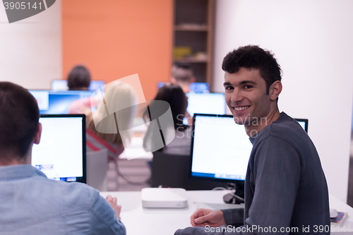 Image of technology students group working  in computer lab school  class