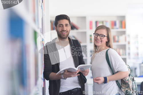 Image of students couple  in school  library