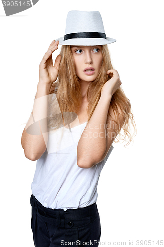 Image of Beautiful slytish woman posing in fedora hat